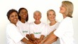 Volunteers raising hands together 