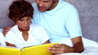 Father reading a story to his son