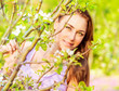Pretty girl in spring garden