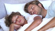 Father and son sleeping together
