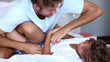 Father and son play fighting and tickling