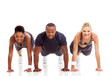 group of fit people doing pushups