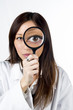 Asian researcher with magnify glass