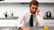 Exhausted man having breakfast