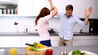 Couple dancing and acting silly in the kitchen