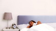 Woman waking up and stretching