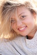 Blonde woman laughing - a closeup