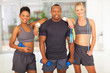 Photo: group of diversity people holding various gym equipment group of diversity people holding various gym equipment