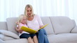 Mother and daughter reading a book together