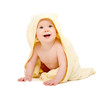 happy beautiful baby in yellow towel isolated