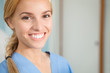 Close up of a nurse looking at camera while smiling