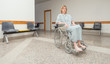 Patient sitting on a wheelchair
