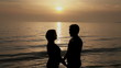 Couple kissing at sunset on the seashore