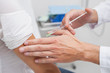 Close up of a doctor doing an injection to the patient arm