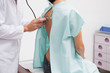 Close up of doctor auscultating the patient back with a stethoscope