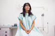 Patient looking up while sitting on a table