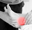 Physiotherapist working on patients highlighted ankle