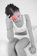 Woman rubbing her head with highlighted pain