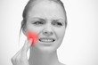 Woman touching red highlighted toothache