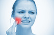 Woman touching highlighted red toothache
