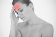 Woman touching head in pain