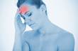 Stressed woman touching head in pain