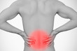 Man holding his back with highlighted pain