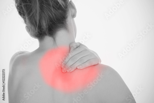 Photo: Woman rubbing shoulder pain Woman rubbing shoulder pain