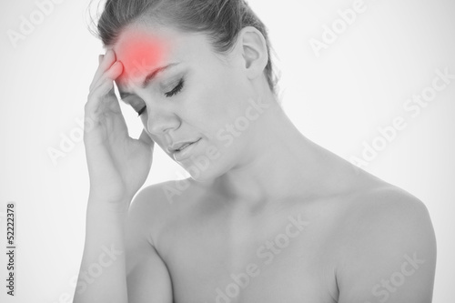 Photo: Woman touching head in pain Woman touching head in pain