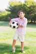 Boy posing with his football