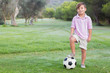 Smiling boy posing with football