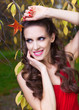 A beautiful brunette in red dress