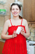  woman in red with melamine sponge
