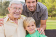Portrait of grandfather father and son smiling