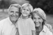 Black and white portrait of grandparents with grandson