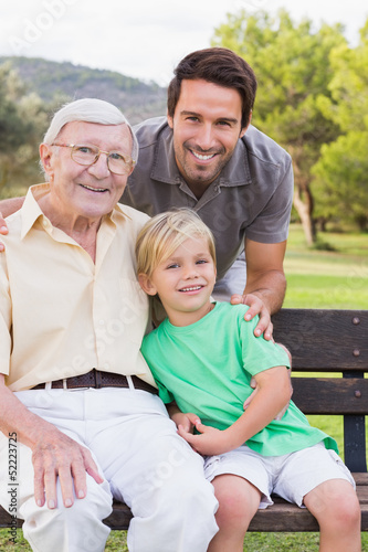 Photo: Portrait of three generations of men of family Portrait of three generations of men of family