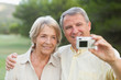 Couple taking a photo of themselves and smiling