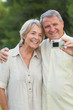 Older couple smiling for a photo