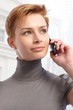 Photo: Young woman on the phone Young woman on the phone