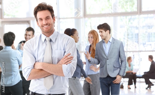 Photo: Portrait of happy young businessman Portrait of happy young businessman