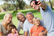 Father taking photo of family