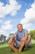 Older man stretching in the park