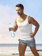 Athletic man jogging on the beach