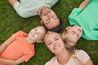 Overhead of family lying on the grass
