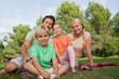 Portrait of family sitting on picnic blanket