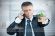 Businessman selecting graph from touchscreen