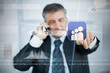 Businessman selecting social network application from touchscreen