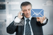 Businessman selecting email application on touchscreen