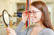 Young woman checking her new glasses
