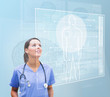 Nurse looking up to interface showing human form